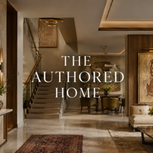 Art placement in a luxury Indian home with wall architecture, layered lighting, natural stone, custom furniture, and curated artwork.